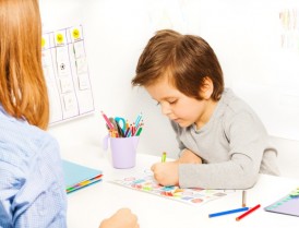 boy-coloring-with-therapist